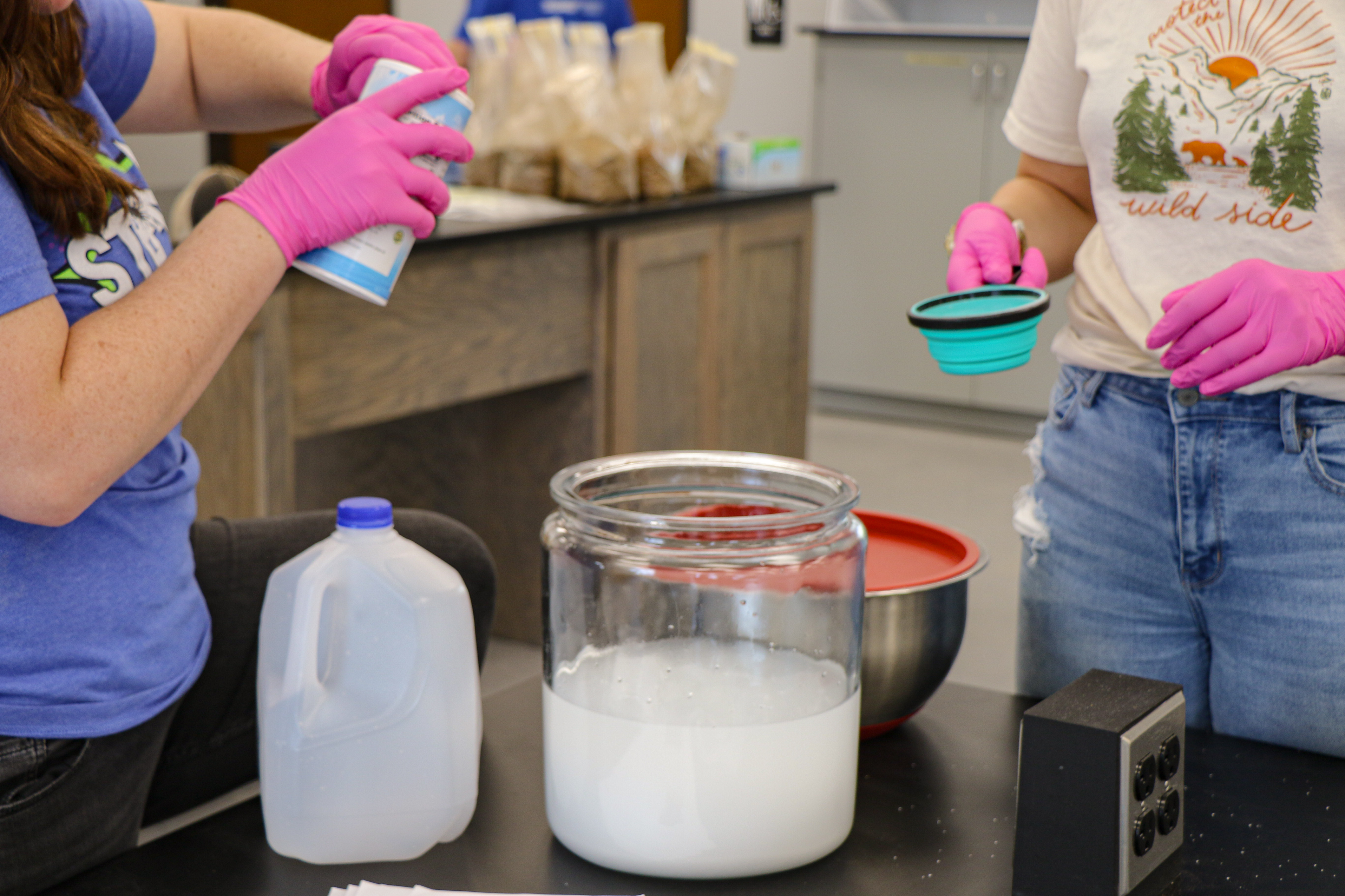 Students mixing a solution in the lab classroom.