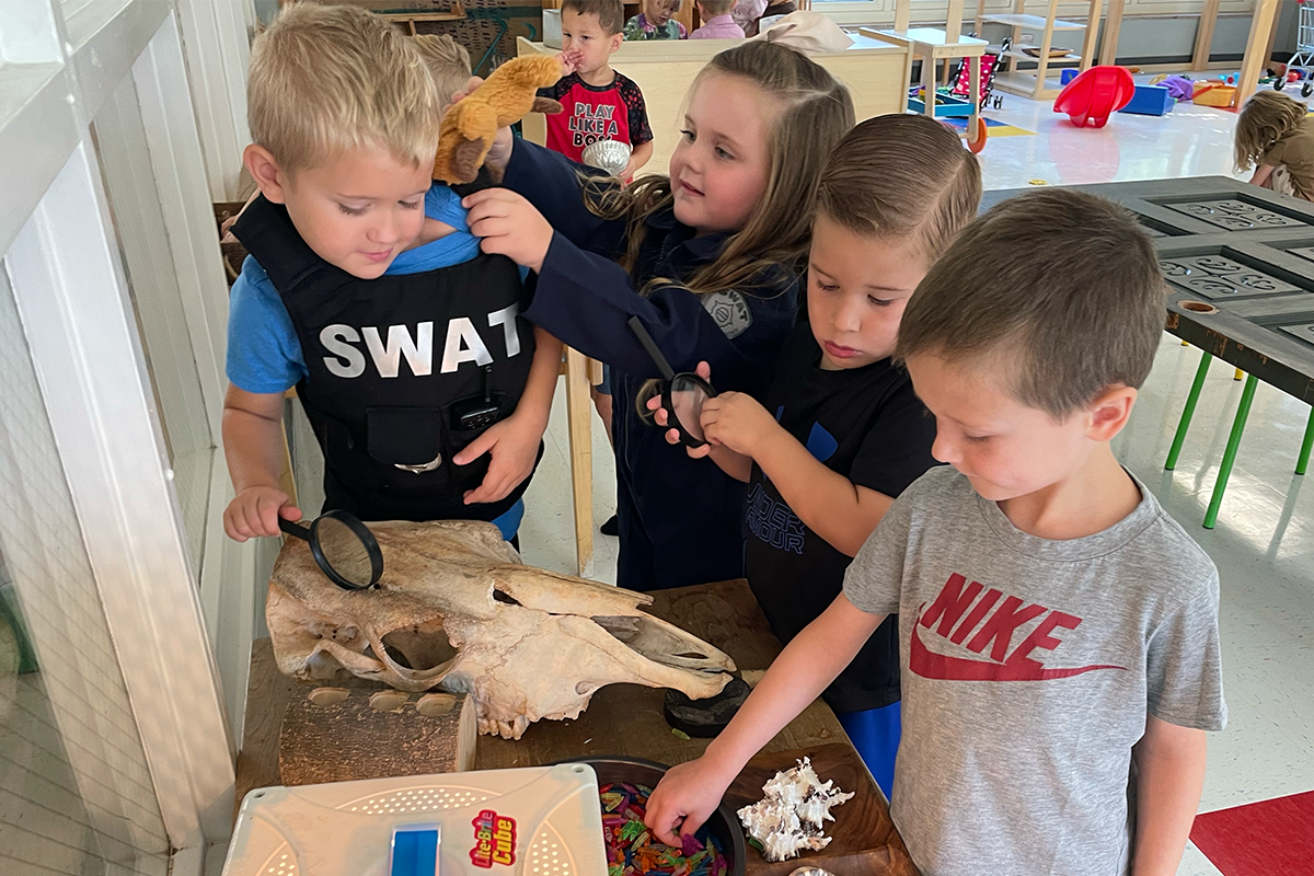 children exploring items on a table