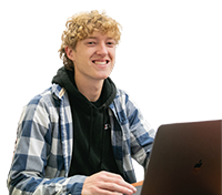 Smiling student at a computer