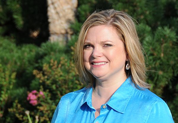 head shot of new communications director, Kelly Arnold