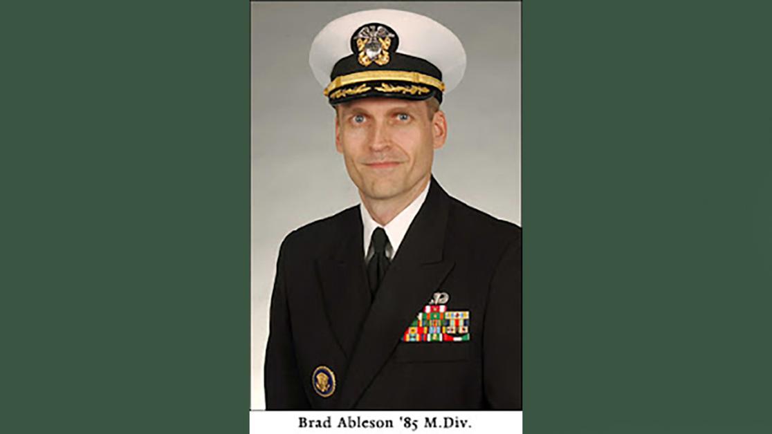 A headshot of Bradford Ableson in full Navy dress uniform from his graduation at Yale Divinity School