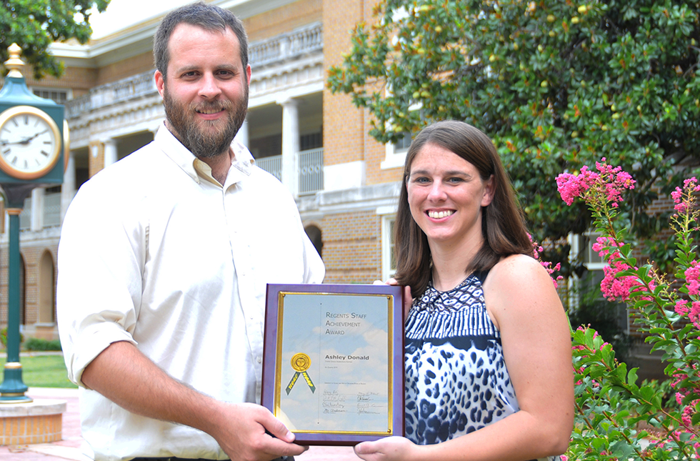 Ashley Donald receiving the award 