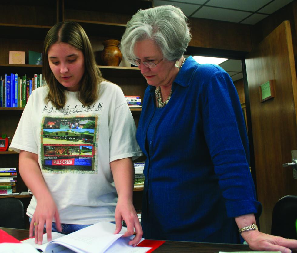 Dr. Brickman working a student 