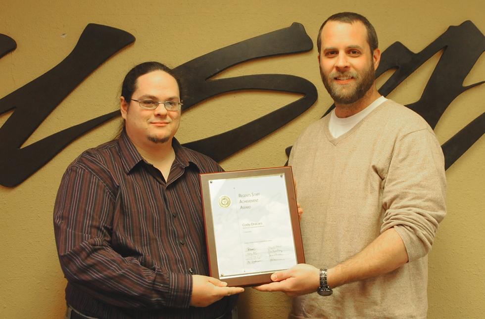 Cody Dracars receiving an award 