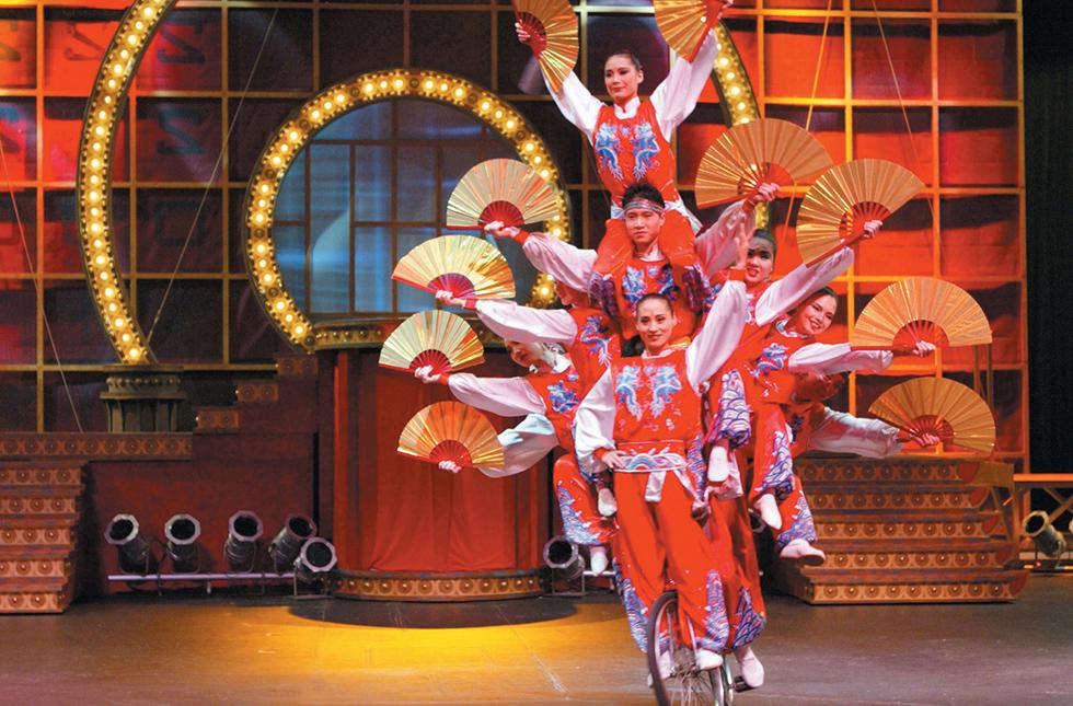 The Golden Dragon Acrobats performing on stage 
