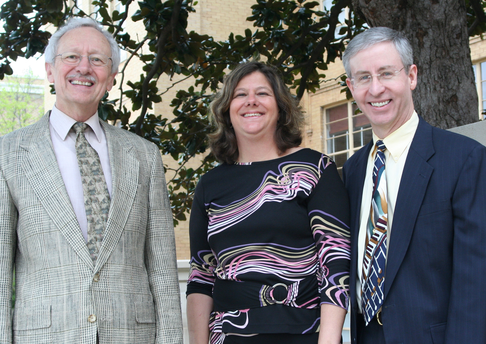 Dr. Dan Hanson, Dr. Brenda Brown, and Dr. John Miller posing.
