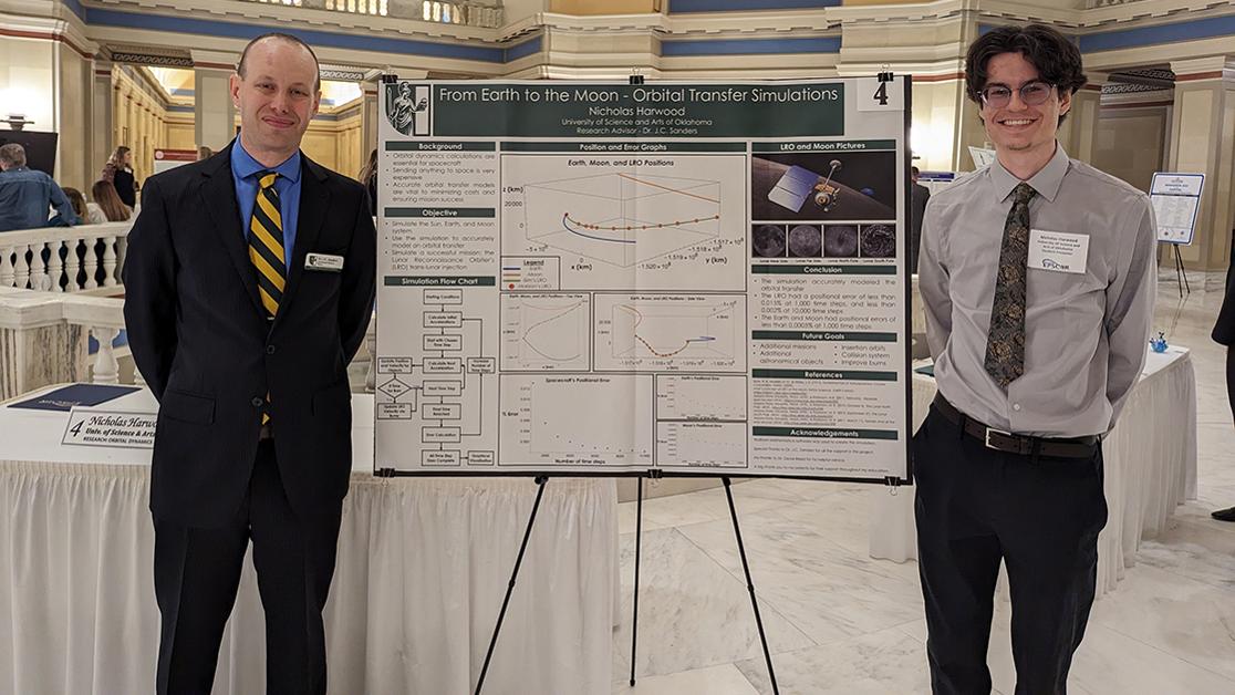 A photo of student Nick Harwood with his research presentation beside professor of physics and research advisor Dr. J.C. Sanders at the Oklahoma Capitol