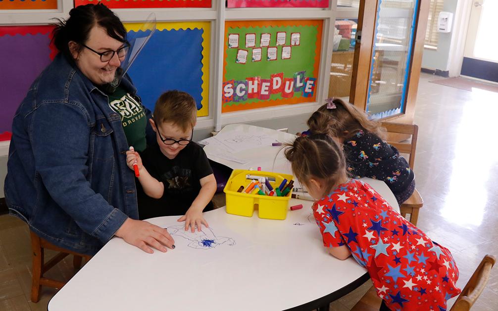 One of USAO's teachers-in-training working with students in the Child Development Center