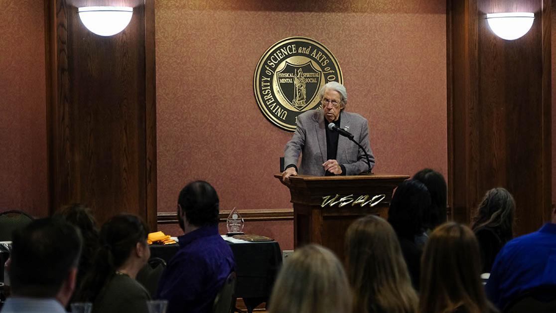 President Feaver welcomes students and families during the 2022 Minerva Awards ceremony.